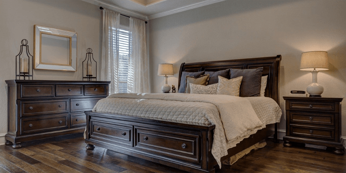 bedroom set with hardwood floors